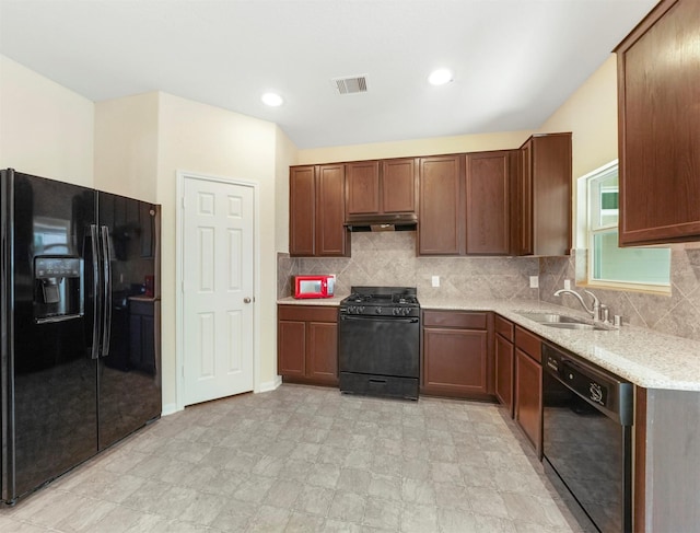 20611 Footstep Path, Katy, TX 77449 - kitchen featuring black appliances, under cabinet range hood, a sink, backsplash, and light stone counters