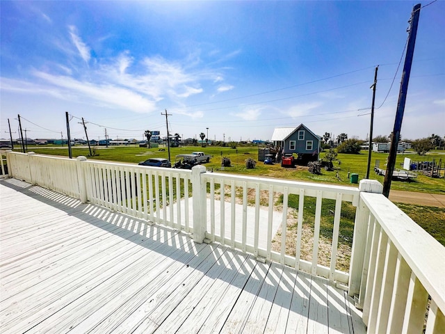 1032 N Selwyn Rd, Crystal Beach, TX 77650 - wooden deck with a lawn