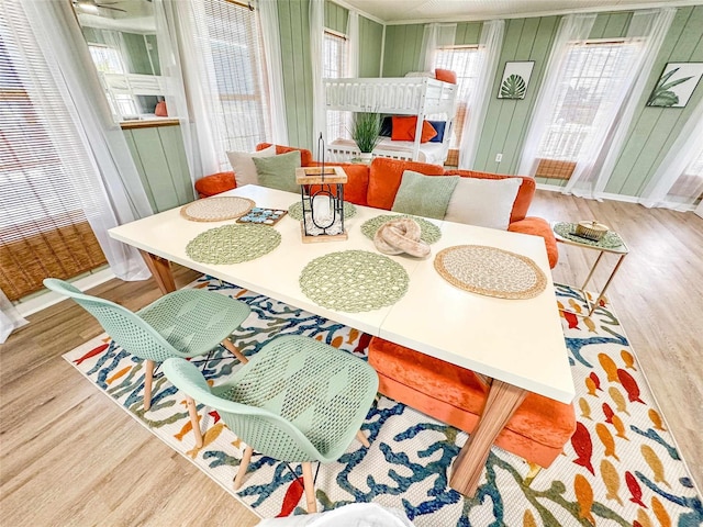 1032 N Selwyn Rd, Crystal Beach, TX 77650 - dining room featuring wood finished floors and plenty of natural light