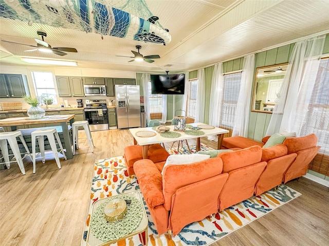 1032 N Selwyn Rd, Crystal Beach, TX 77650 - living room with light wood-type flooring and a ceiling fan