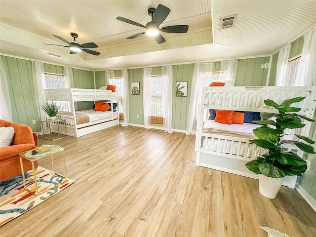 1032 N Selwyn Rd, Crystal Beach, TX 77650 - living room with healthy amount of natural light, wood finished floors, and ceiling fan