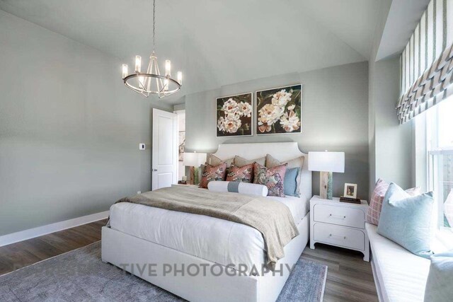 27019 Golden Isle Ln, Katy, TX 77493 - bedroom featuring a chandelier, wood finished floors, lofted ceiling, and baseboards