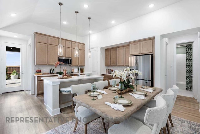 27019 Golden Isle Ln, Katy, TX 77493 - dining room featuring light wood-style flooring, recessed lighting, and lofted ceiling