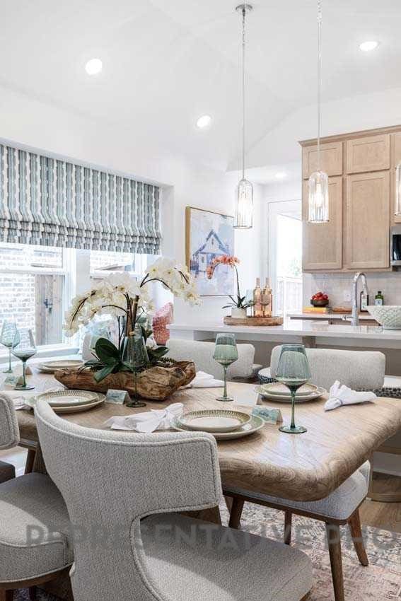 27019 Golden Isle Ln, Katy, TX 77493 - dining room featuring healthy amount of natural light, wood finished floors, recessed lighting, and lofted ceiling