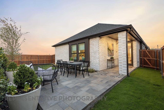 27019 Golden Isle Ln, Katy, TX 77493 - patio terrace at dusk with a patio and outdoor dining space