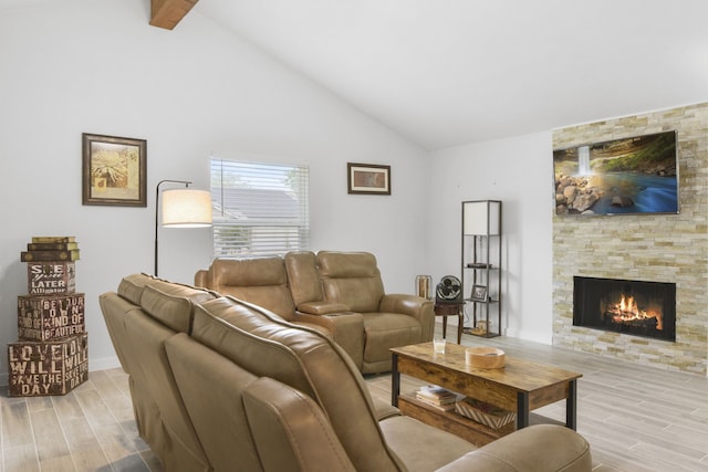 17907 Wolf Hollow Dr, Houston, TX 77084 - living room with wood finish floors, a stone fireplace, beamed ceiling, and high vaulted ceiling