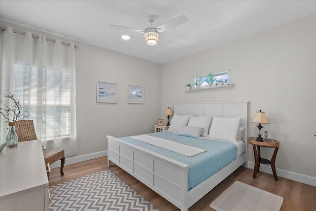 130 Beachcomber Ave, Surfside Beach, TX 77541 - bedroom with wood finished floors, baseboards, and recessed lighting