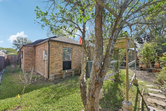 7202 Las Brisas Dr, Houston, TX 77083 - view of side of property featuring brick siding and central AC unit