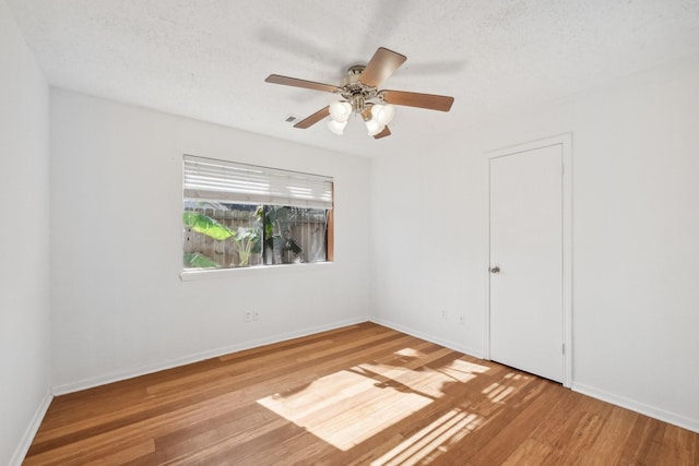 7202 Las Brisas Dr, Houston, TX 77083 - spare room featuring wood finished floors, baseboards, and ceiling fan