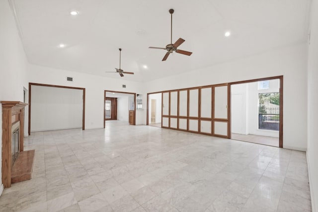 7202 Las Brisas Dr, Houston, TX 77083 - empty room featuring high vaulted ceiling, light marble finish flooring, a ceiling fan, a glass covered fireplace, and recessed lighting