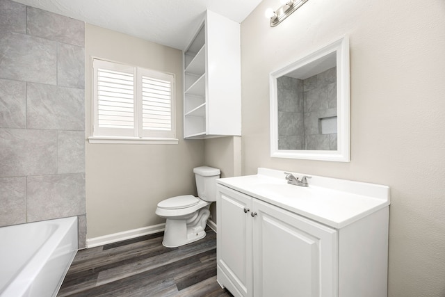 1919 Tallulah Ln, Houston, TX 77077 - bathroom featuring wood finished floors, vanity, toilet, and baseboards