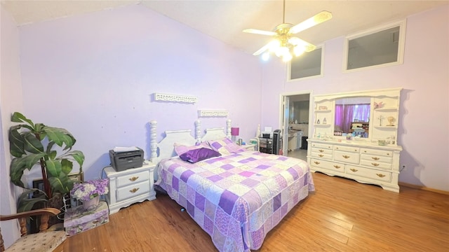 5707 Ancient Oaks Dr, Humble, TX 77346 - bedroom featuring light wood-style floors, high vaulted ceiling, and ceiling fan