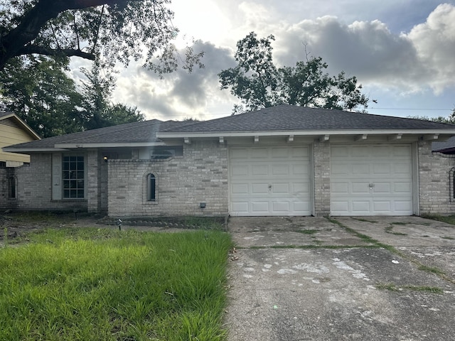 10126 Pine Moss Dr, Houston, TX 77040 - view of side of home featuring driveway, a garage, and brick siding