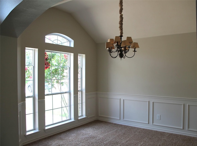 22922 Still Pond Dr, Tomball, TX 77375 - carpeted empty room with a chandelier, wainscoting, vaulted ceiling, and a decorative wall