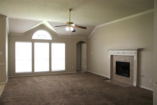 22922 Still Pond Dr, Tomball, TX 77375 - unfurnished living room featuring arched walkways, carpet, lofted ceiling, a fireplace, and ceiling fan