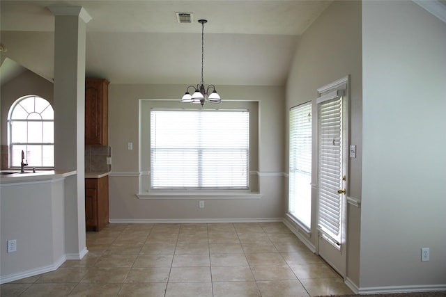 22922 Still Pond Dr, Tomball, TX 77375 - unfurnished dining area with vaulted ceiling, a chandelier, and light tile patterned floors