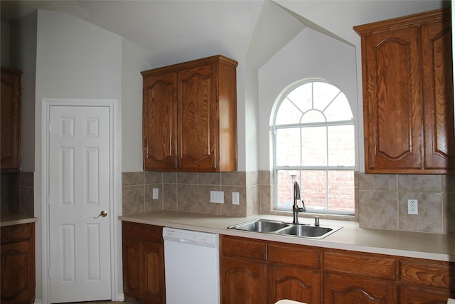 22922 Still Pond Dr, Tomball, TX 77375 - kitchen featuring white dishwasher, light countertops, tasteful backsplash, and lofted ceiling