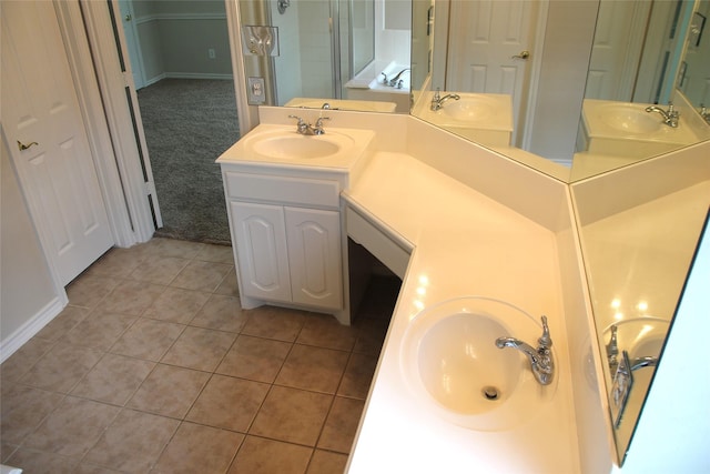 22922 Still Pond Dr, Tomball, TX 77375 - full bath featuring two vanities, tile patterned flooring, and a stall shower