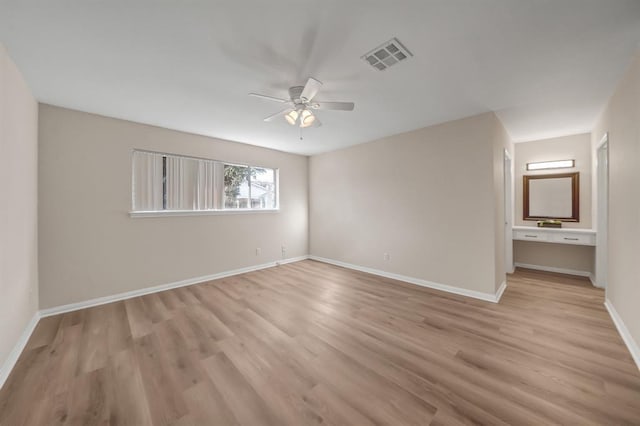 9039 Sandstone St, Houston, TX 77036 - unfurnished bedroom with light wood-type flooring, baseboards, and ceiling fan