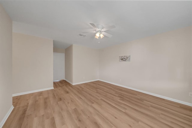 9039 Sandstone St, Houston, TX 77036 - unfurnished room featuring light wood finished floors, a ceiling fan, and baseboards