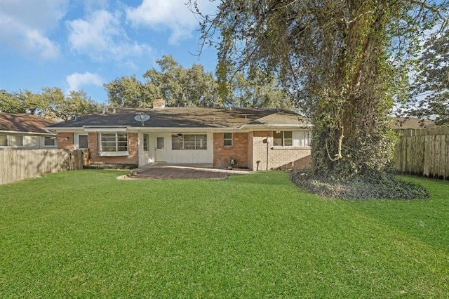9039 Sandstone St, Houston, TX 77036 - rear view of property featuring a patio area, brick siding, and a chimney