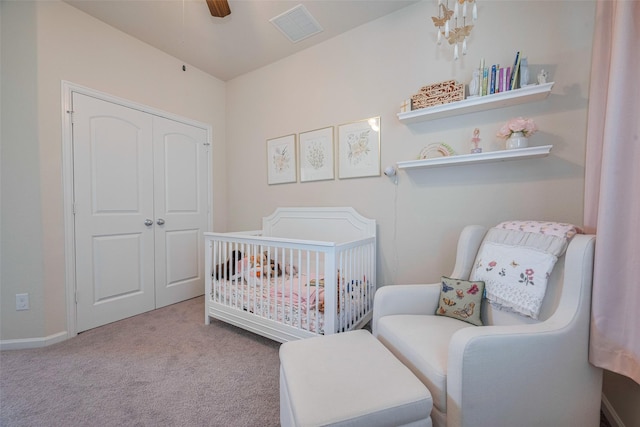 10712 Addicks Oaks Pl, Houston, TX 77043 - bedroom featuring a crib, carpet, a closet, a ceiling fan, and baseboards