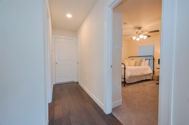 10712 Addicks Oaks Pl, Houston, TX 77043 - hallway with dark wood-style floors and baseboards