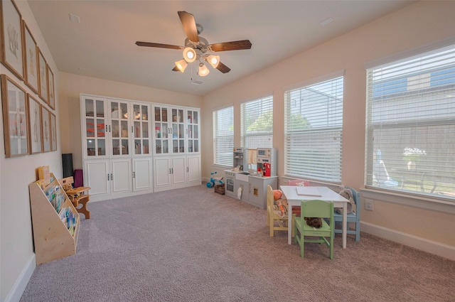 10712 Addicks Oaks Pl, Houston, TX 77043 - recreation room featuring ceiling fan, baseboards, and carpet floors