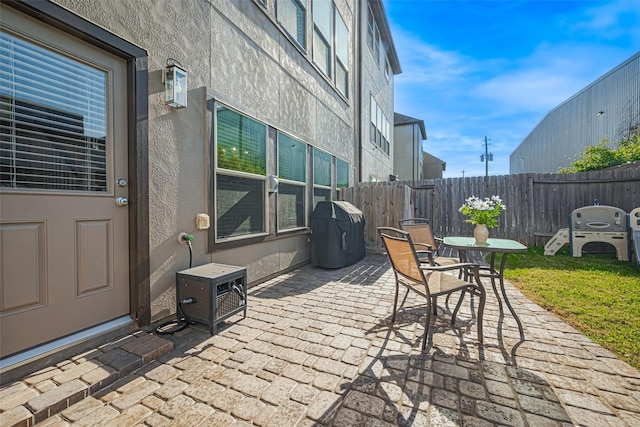 10712 Addicks Oaks Pl, Houston, TX 77043 - view of patio featuring a grill, outdoor dining area, and a cooling unit
