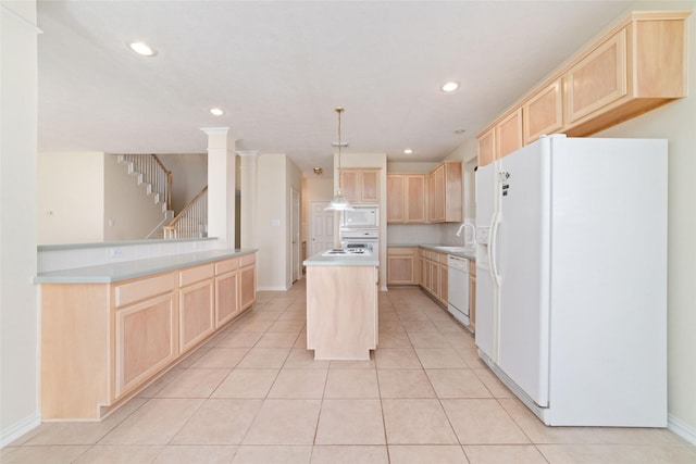 12236 S Shadow Cove Dr, Houston, TX 77082 - kitchen with white appliances, light brown cabinets, a sink, a center island, and recessed lighting