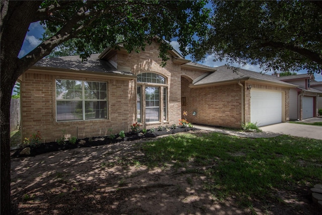 1511 Ashley Ct, Tomball, TX 77375 - view of front of house featuring brick siding, an attached garage, concrete driveway, and a shingled roof