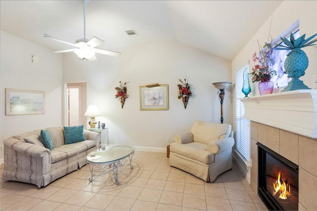 1511 Ashley Ct, Tomball, TX 77375 - living room featuring lofted ceiling, a tiled fireplace, light tile patterned flooring, ceiling fan, and baseboards