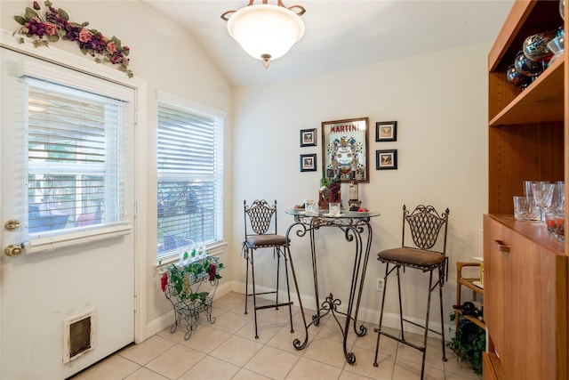 1511 Ashley Ct, Tomball, TX 77375 - tiled dining room with heating unit, plenty of natural light, lofted ceiling, and baseboards