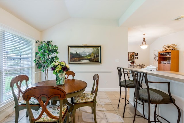 1511 Ashley Ct, Tomball, TX 77375 - dining room with lofted ceiling and light tile patterned flooring