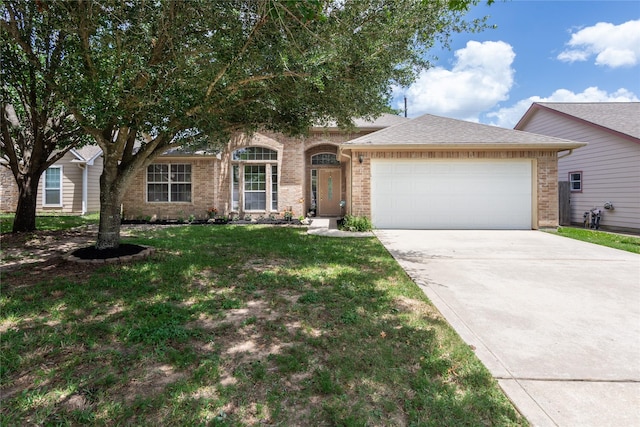 1511 Ashley Ct, Tomball, TX 77375 - view of front of property featuring an attached garage, driveway, brick siding, a front yard, and roof with shingles