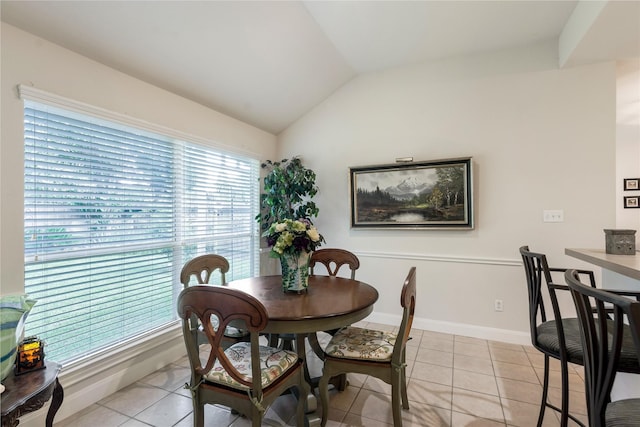 1511 Ashley Ct, Tomball, TX 77375 - dining room with vaulted ceiling, light tile patterned floors, and baseboards
