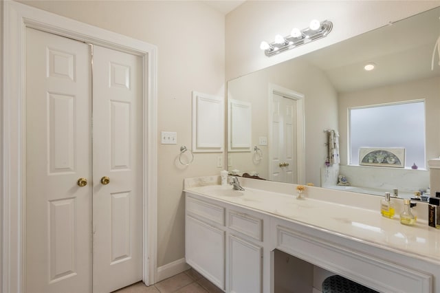 1511 Ashley Ct, Tomball, TX 77375 - full bathroom featuring double vanity, tile patterned flooring, and baseboards