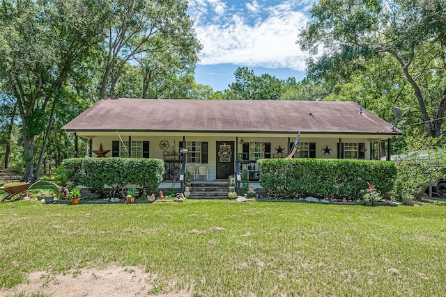 200 Little Pine Valley Rd, Cleveland, TX 77328 - ranch-style house featuring a porch and a front lawn