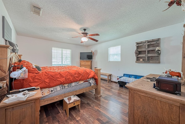 200 Little Pine Valley Rd, Cleveland, TX 77328 - bedroom featuring a textured ceiling, dark wood-type flooring, and a ceiling fan