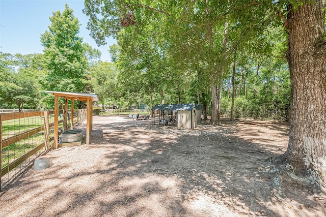 200 Little Pine Valley Rd, Cleveland, TX 77328 - view of yard with an outbuilding