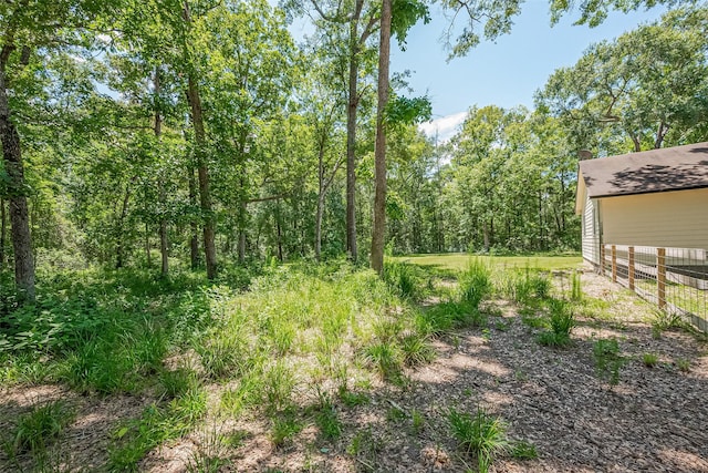 200 Little Pine Valley Rd, Cleveland, TX 77328 - view of yard featuring a view of trees