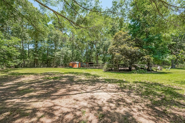 200 Little Pine Valley Rd, Cleveland, TX 77328 - view of green lawn with a shed