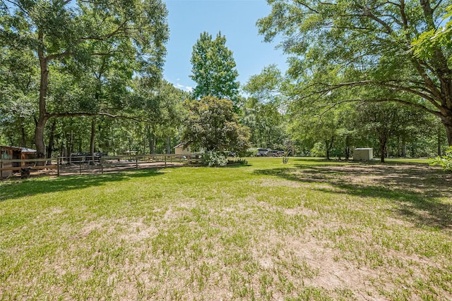 200 Little Pine Valley Rd, Cleveland, TX 77328 - view of yard featuring a storage unit