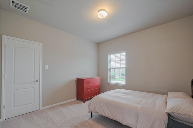 25203 Azel Shore Ct, Porter, TX 77365 - bedroom featuring light carpet and baseboards