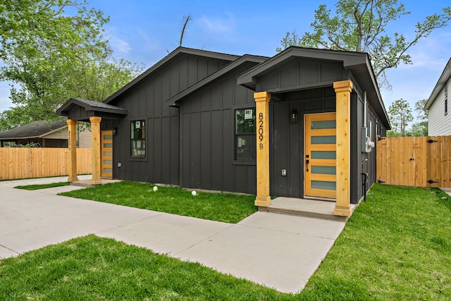 8209 Richland St A/B, Unit A/B Houston, TX 77028 - contemporary home with board and batten siding and a gate