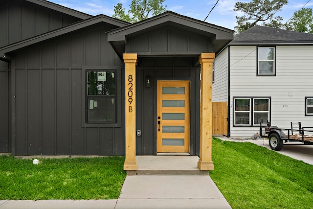 8209 Richland St A/B, Unit A/B Houston, TX 77028 - entrance to property featuring board and batten siding and a yard