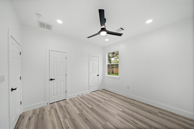 8209 Richland St A/B, Unit A/B Houston, TX 77028 - unfurnished bedroom with light wood-style floors, recessed lighting, baseboards, and a ceiling fan