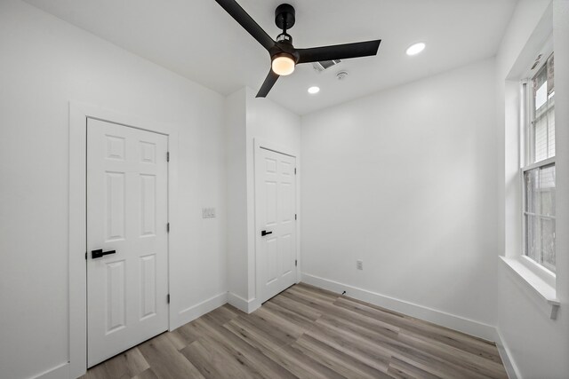 8209 Richland St A/B, Unit A/B Houston, TX 77028 - unfurnished bedroom with light wood-style floors, baseboards, recessed lighting, and a ceiling fan