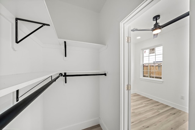 8209 Richland St A/B, Unit A/B Houston, TX 77028 - spacious closet with light wood-style flooring and ceiling fan