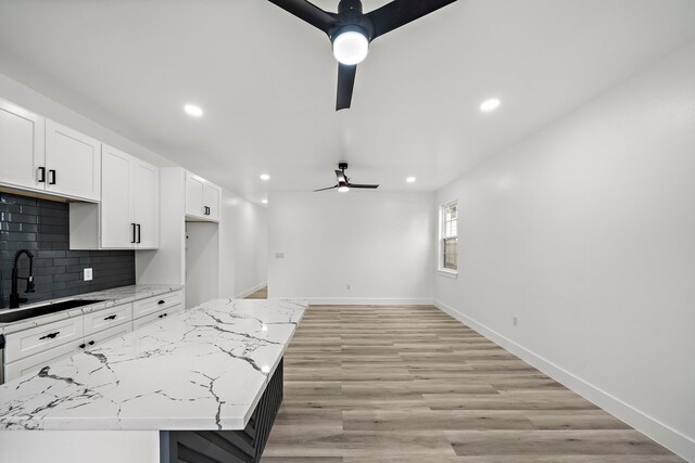 8209 Richland St A/B, Unit A/B Houston, TX 77028 - kitchen featuring a sink, a ceiling fan, recessed lighting, decorative backsplash, and white cabinetry